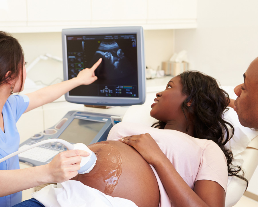 Pregnant-woman-at-an-ultrasound-appointment-with-the-best-OBGYN-in-Houston